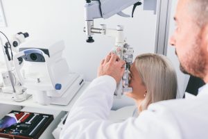Accent Eye Care optitian-testing-his-patients-eyesight-DCM6GFY  
