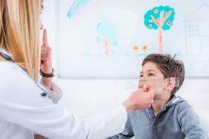 Accent Eye Care pediatrician-examining-boy-s-eyes-with-ruler-UAYLK4J  